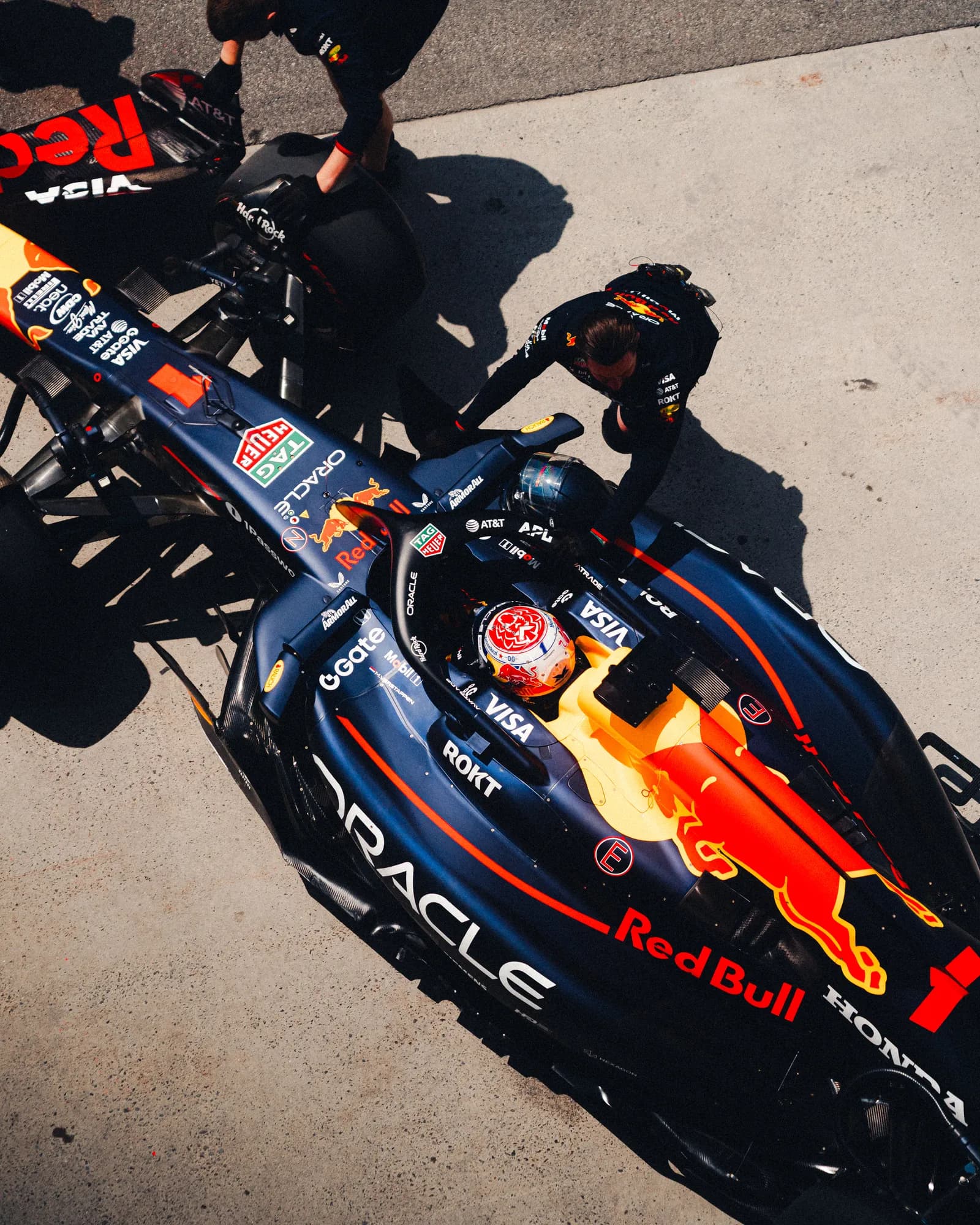 Red Bull pit crew around the car, shot from above the pit lane