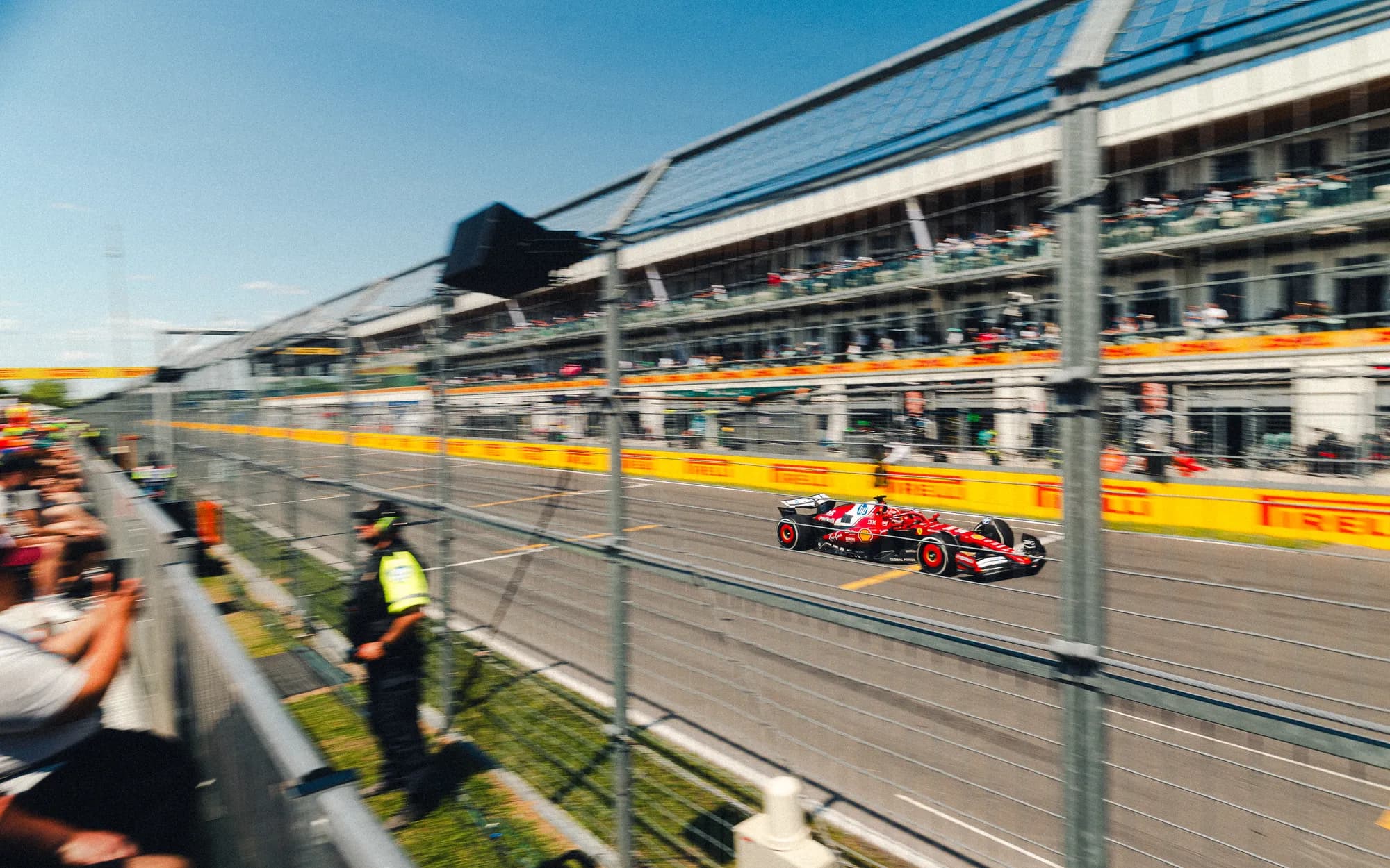 Formula 1 cars streaming down the start-finish straight at Circuit Gilles-Villeneuve