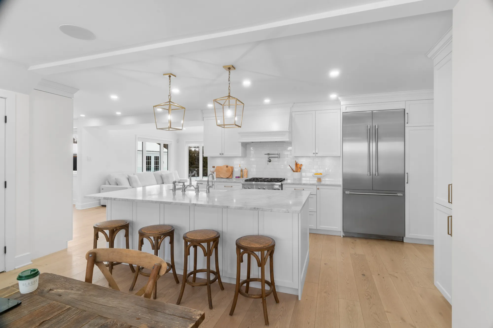 Marble kitchen island with wooden stools