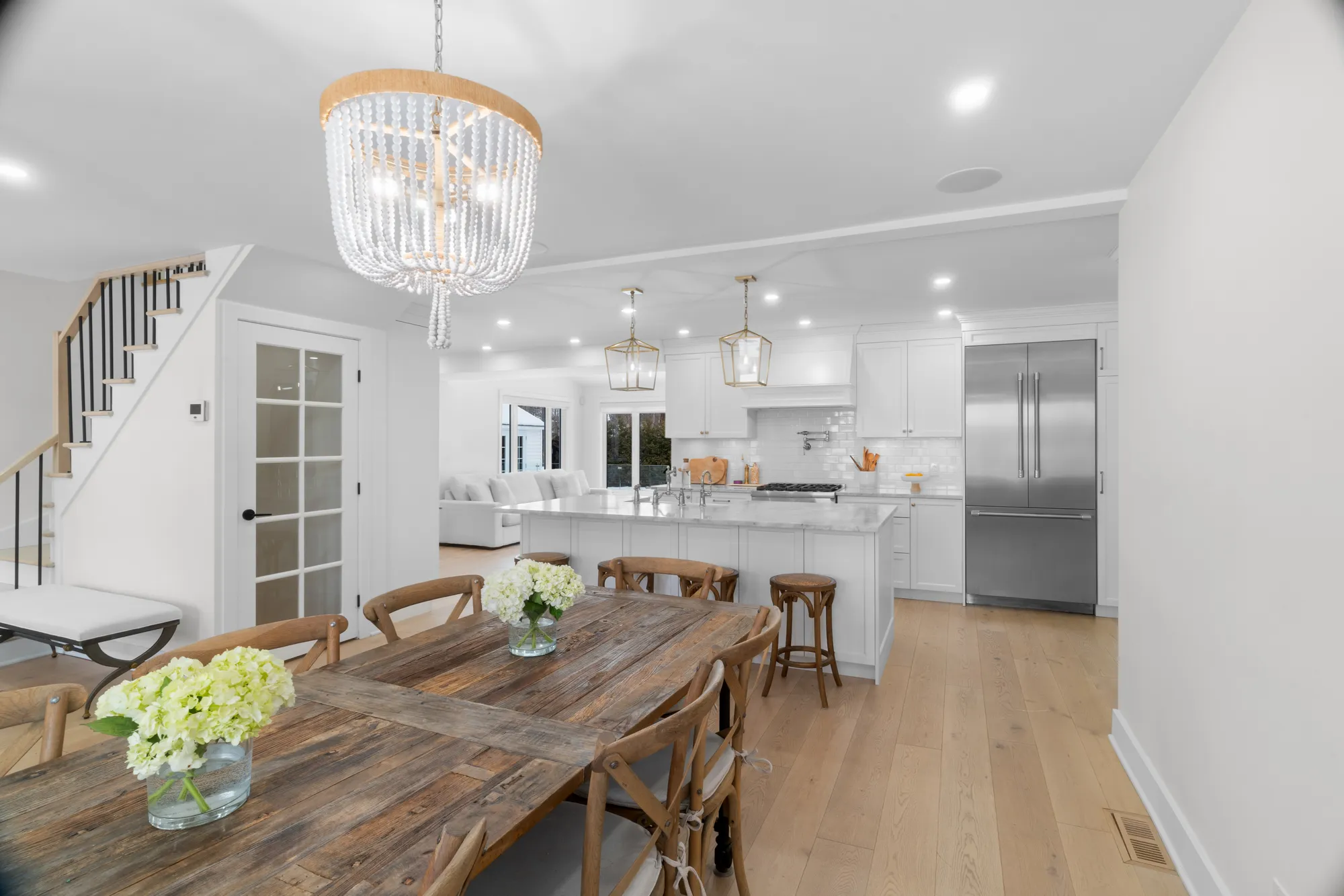 Kitchen and dining room under a crystal chandelier at 155 Shannon Park