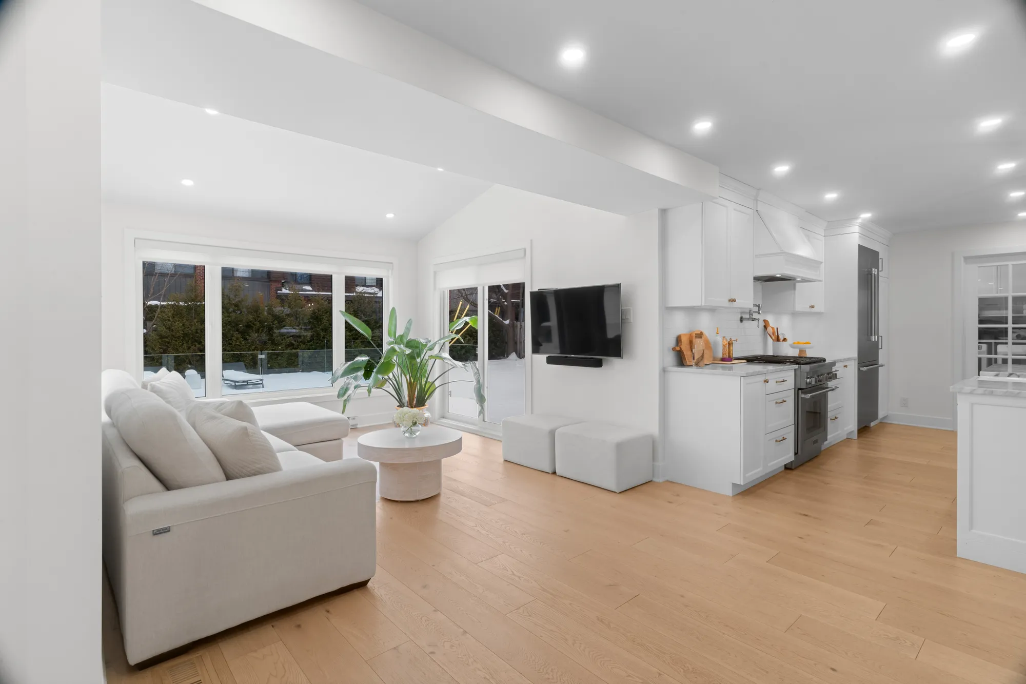 Family room open to the kitchen, flooded with daylight
