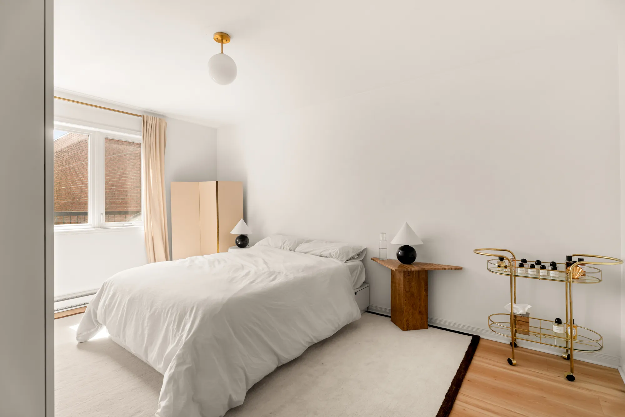 Bedroom with bar cart and soft window light