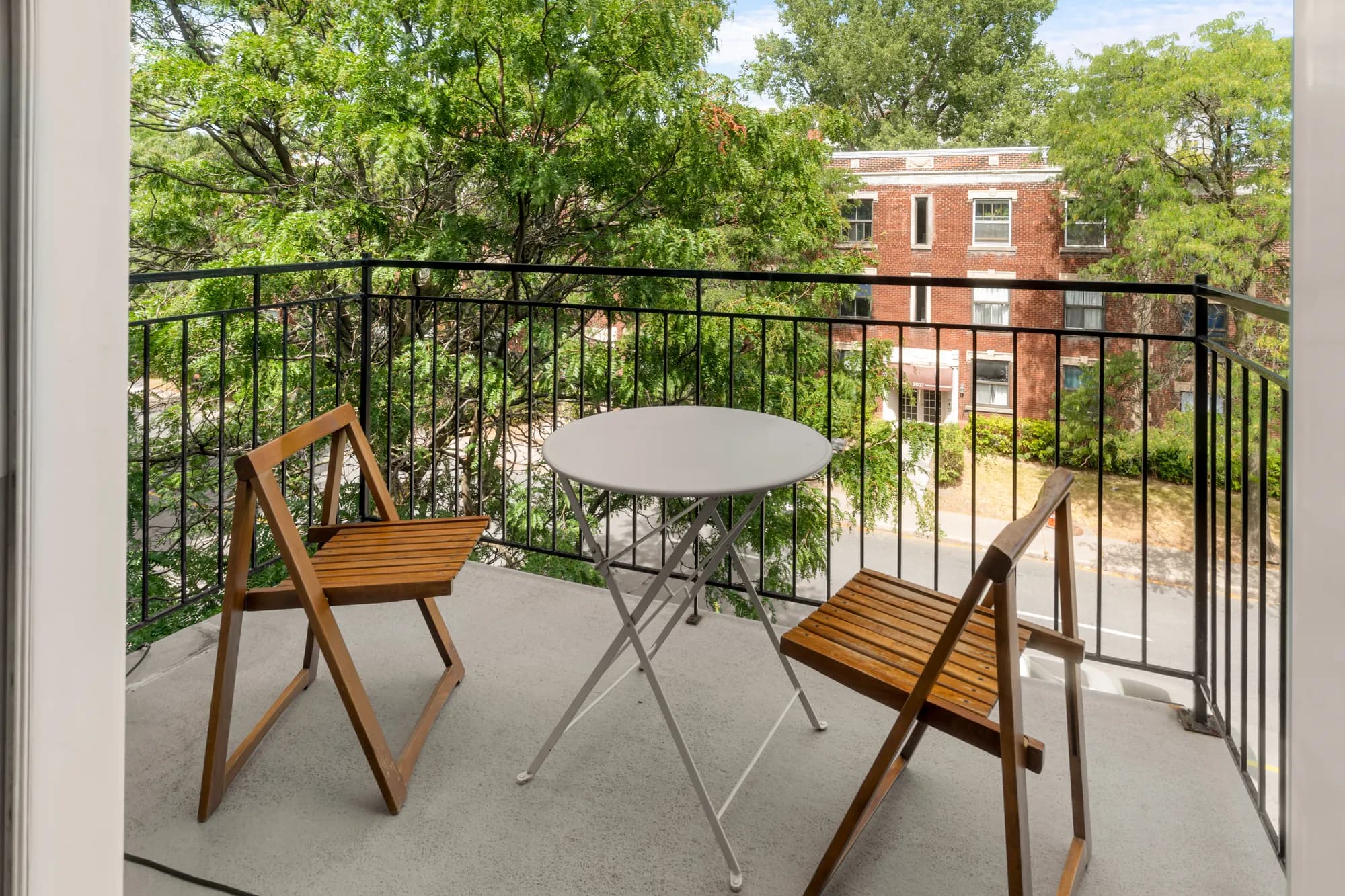 Private terrace with bistro set over the treetops