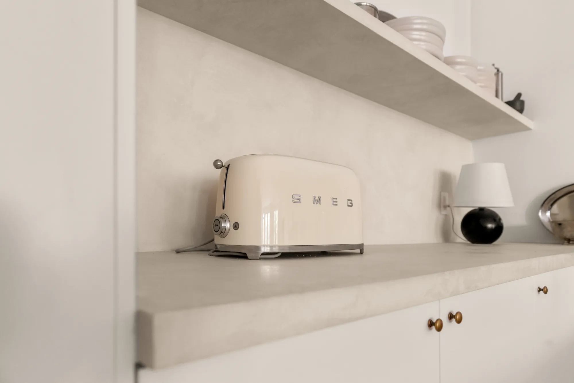 Counter still life with cream retro toaster