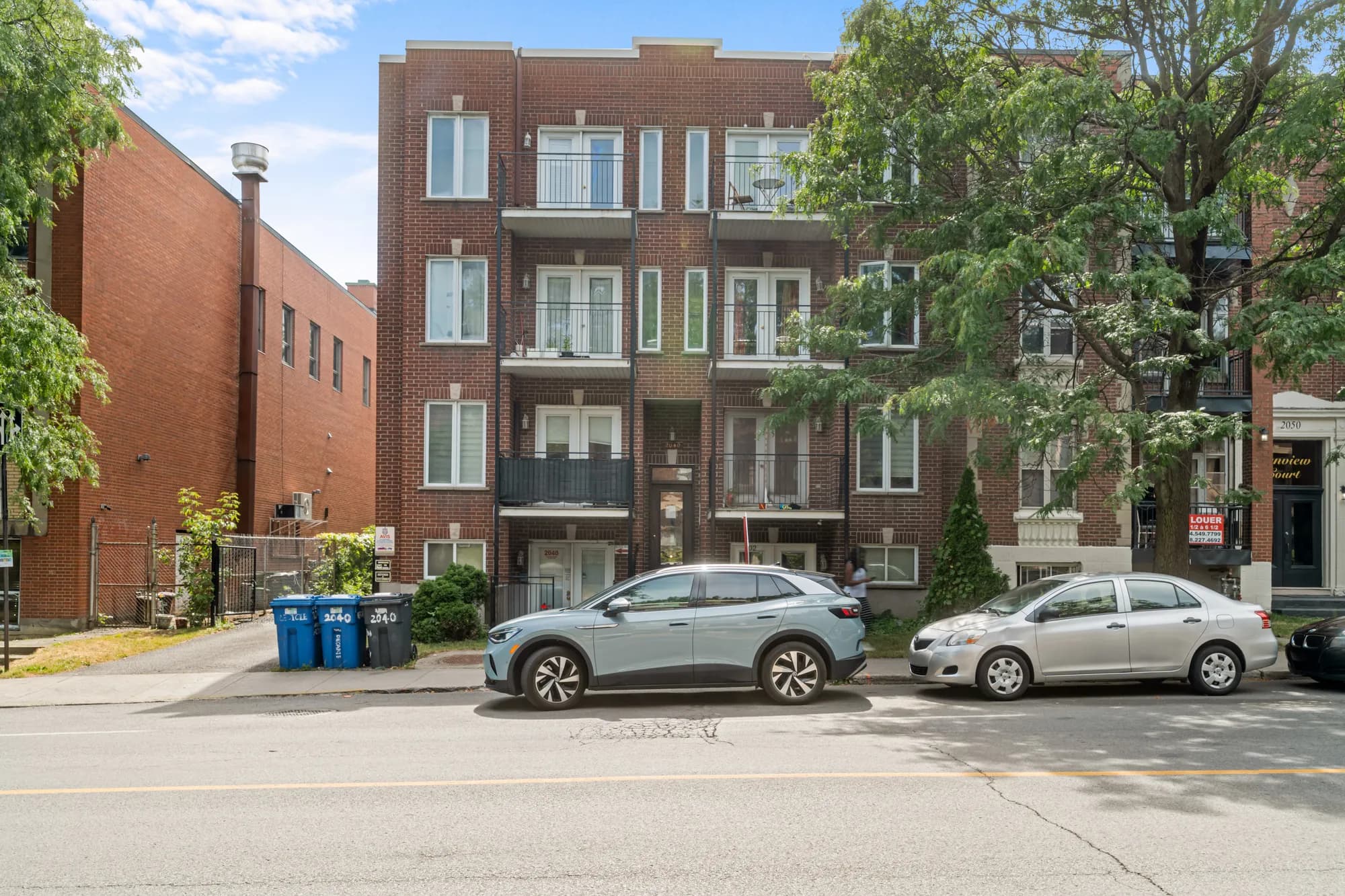 Red-brick facade of the building from the street