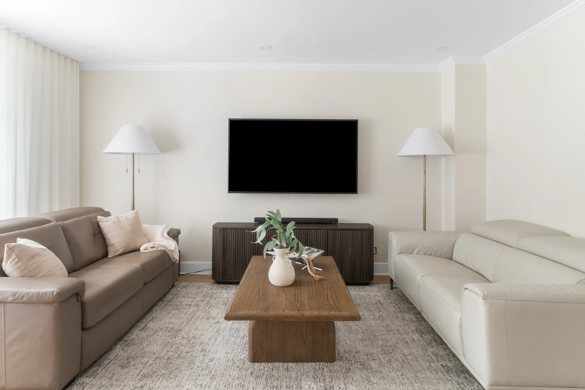 Living room with layered neutral seating
