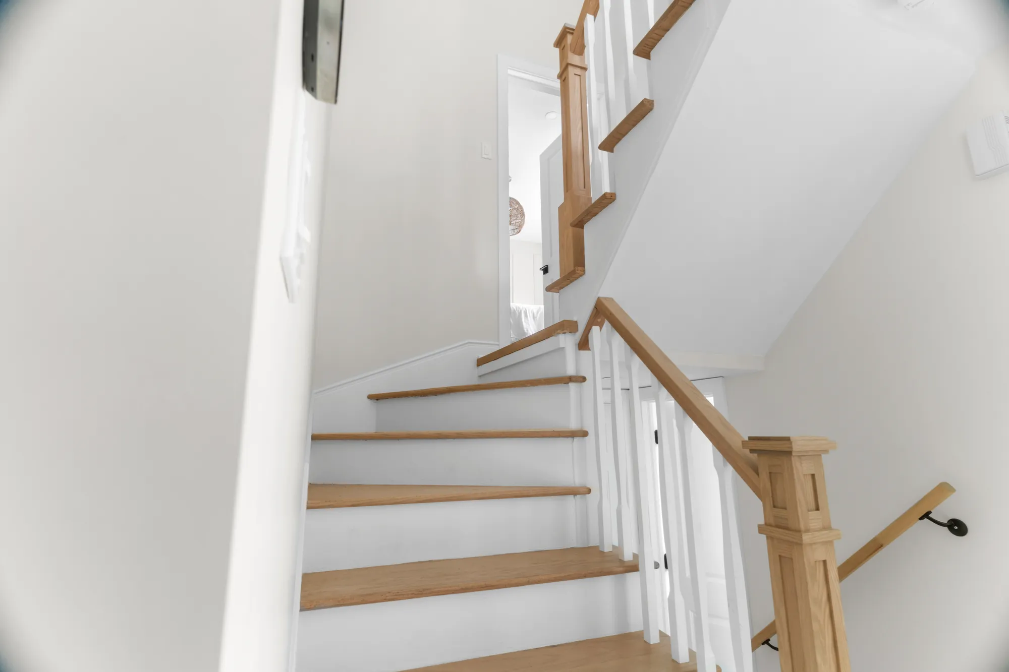 White-oak staircase with traditional balustrade
